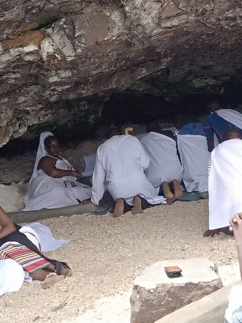 White cloth kneeling work inside the cave