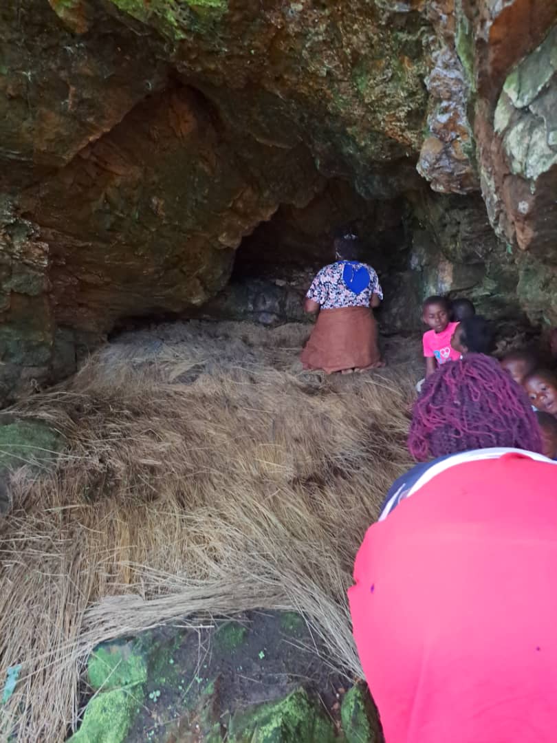 First chamber of Nalubaale Cave with hay on the floor